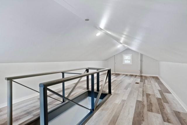 444 27th St, Mckeesport, PA 15132 - additional living space featuring wood finished floors and vaulted ceiling