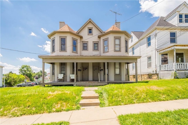 625 N Main St, City Of Washington, PA 15301 - view of front of home with covered porch, a front lawn, and a chimney