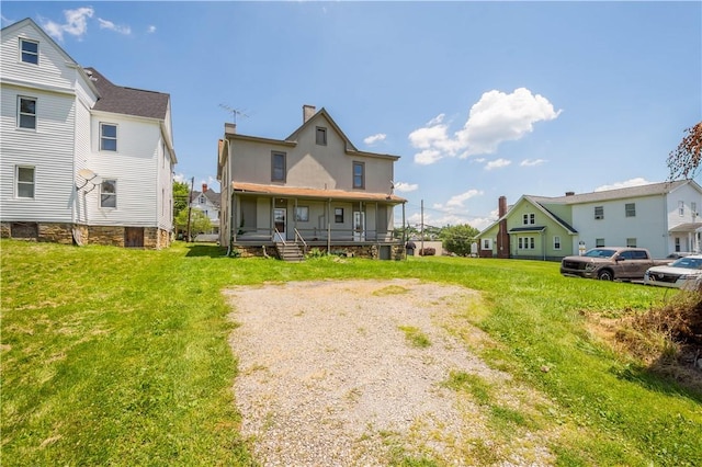 625 N Main St, City Of Washington, PA 15301 - back of house featuring a porch, a residential view, and a lawn