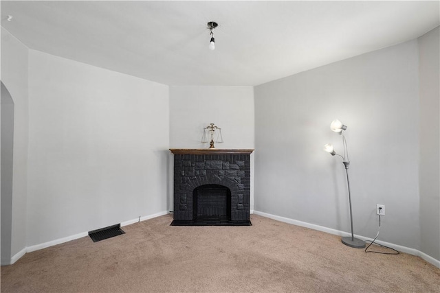 625 N Main St, City Of Washington, PA 15301 - unfurnished living room with carpet, arched walkways, and a fireplace with flush hearth