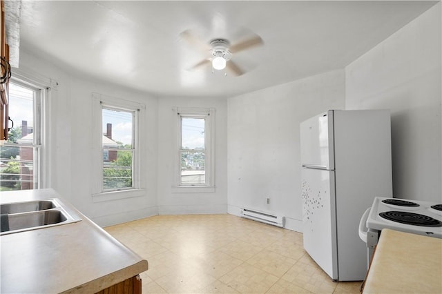 625 N Main St, City Of Washington, PA 15301 - kitchen featuring a baseboard heating unit, ceiling fan, white appliances, light countertops, and light floors