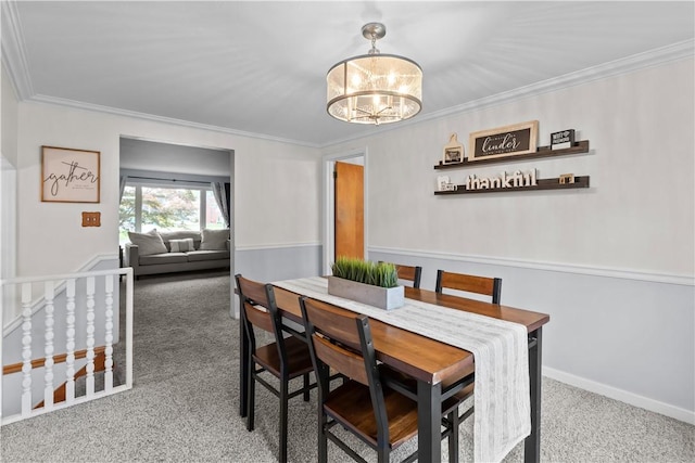 217 Westmont Rd, Ross Twp, PA 15237 - carpeted dining area with a chandelier and ornamental molding