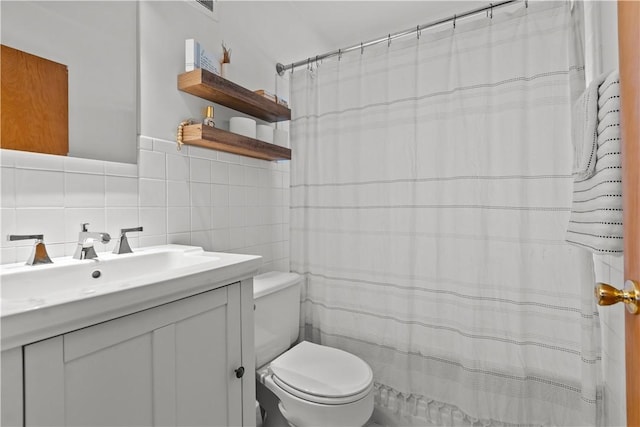 217 Westmont Rd, Ross Twp, PA 15237 - bathroom with tile walls, vanity, tasteful backsplash, and a shower with curtain