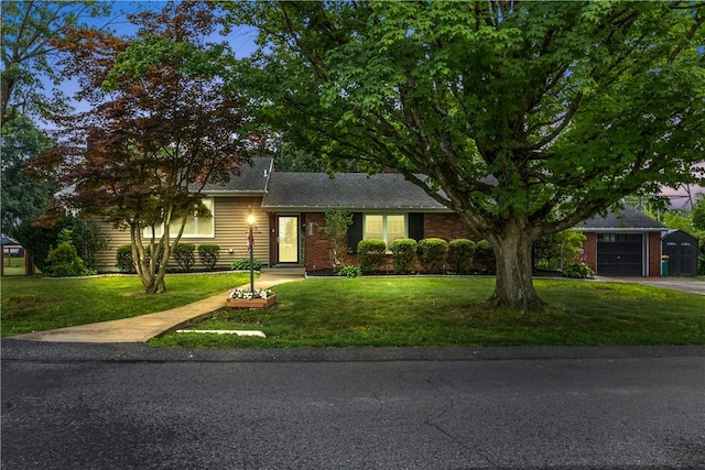 217 Westmont Rd, Ross Twp, PA 15237 - view of front of property with a front lawn, driveway, an attached garage, and brick siding