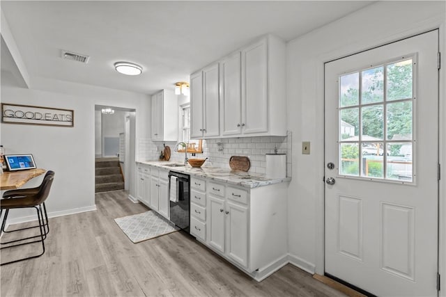 217 Westmont Rd, Ross Twp, PA 15237 - kitchen featuring dishwasher, healthy amount of natural light, decorative backsplash, and light wood-style flooring