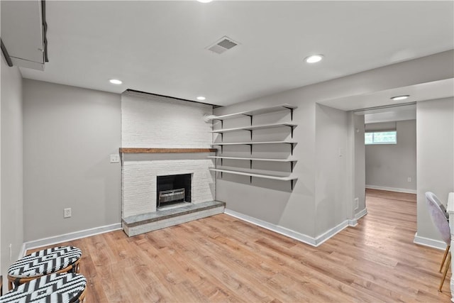 217 Westmont Rd, Ross Twp, PA 15237 - unfurnished living room featuring light wood-style floors, a fireplace, and recessed lighting
