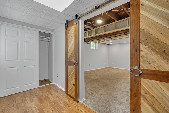 105 Eakin Dr, Brighton Twp, PA 15009 - below grade area featuring a barn door and light wood-style floors