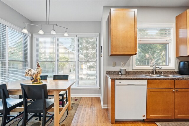 30 S 18th St, South Side, PA 15203 - kitchen with dishwasher, dark countertops, light wood finished floors, and brown cabinets