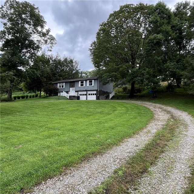 503 Bagdad Rd, Allegheny Twp, PA 15656 - split foyer home featuring driveway, an attached garage, and a front lawn