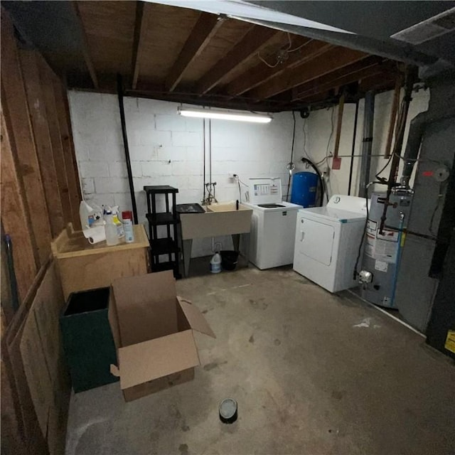 503 Bagdad Rd, Allegheny Twp, PA 15656 - unfinished below grade area with washing machine and clothes dryer, gas water heater, and a water pressure tank