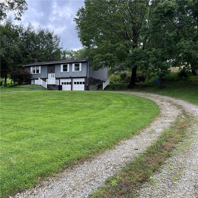 503 Bagdad Rd, Allegheny Twp, PA 15656 - split foyer home with driveway, a garage, and a front yard