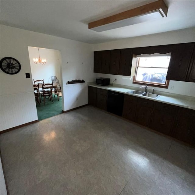 503 Bagdad Rd, Allegheny Twp, PA 15656 - kitchen featuring light flooring, light countertops, a chandelier, and dark brown cabinets
