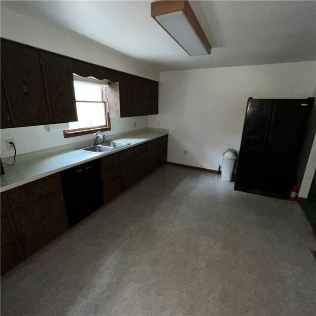503 Bagdad Rd, Allegheny Twp, PA 15656 - kitchen with dishwasher, light countertops, and dark brown cabinets