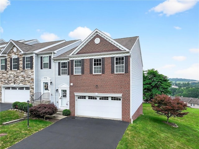 2000 Moccasin Dr, South Strabane, PA 15301 - view of front of property featuring a front lawn, asphalt driveway, and a garage
