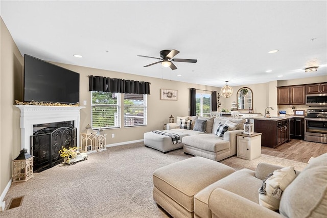 2000 Moccasin Dr, South Strabane, PA 15301 - living area featuring healthy amount of natural light, ceiling fan, a fireplace, recessed lighting, and a chandelier