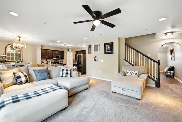 2000 Moccasin Dr, South Strabane, PA 15301 - living area with stairway, arched walkways, recessed lighting, light colored carpet, and a ceiling fan