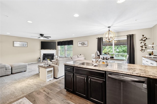 2000 Moccasin Dr, South Strabane, PA 15301 - kitchen with dishwasher, a chandelier, ceiling fan, light wood-style floors, and a fireplace