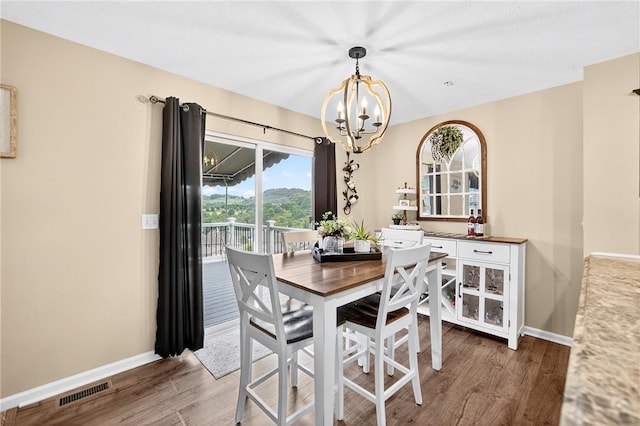 2000 Moccasin Dr, South Strabane, PA 15301 - dining area featuring a chandelier and wood finished floors