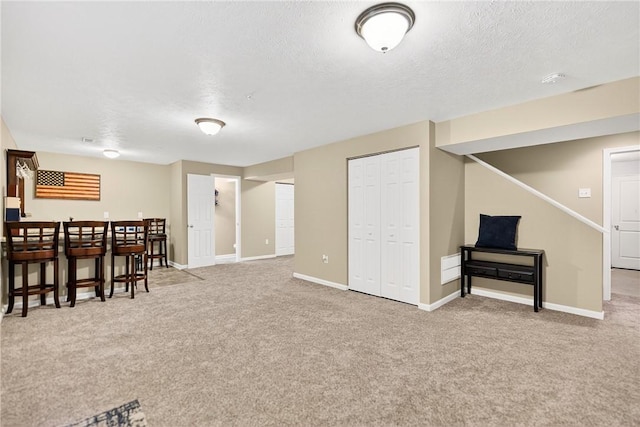 2000 Moccasin Dr, South Strabane, PA 15301 - finished below grade area with carpet flooring, a textured ceiling, and a bar