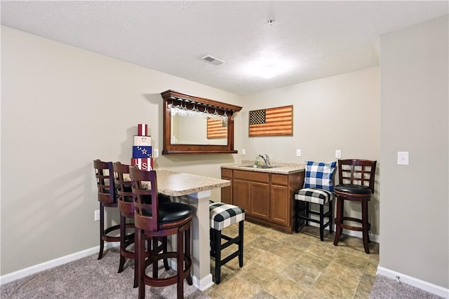 2000 Moccasin Dr, South Strabane, PA 15301 - dining space featuring wet bar and baseboards