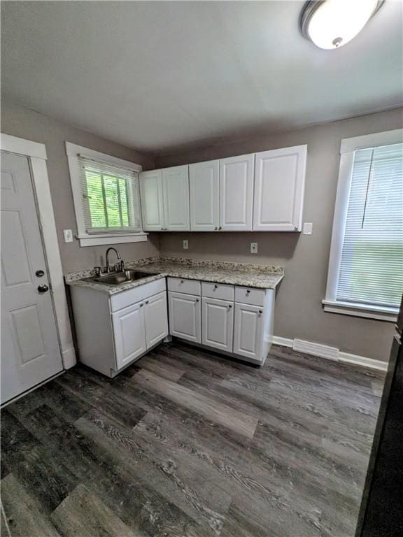 1819 Scott St, Mckeesport, PA 15132 - kitchen with white cabinetry and dark wood-type flooring