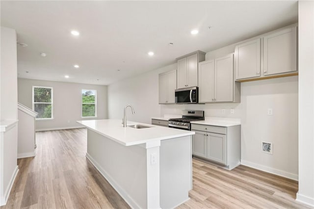 118 River Ridge Drive, Moon/Crescent Twp, PA 15108 - kitchen with stainless steel appliances, gray cabinets, light wood-style floors, an island with sink, and recessed lighting