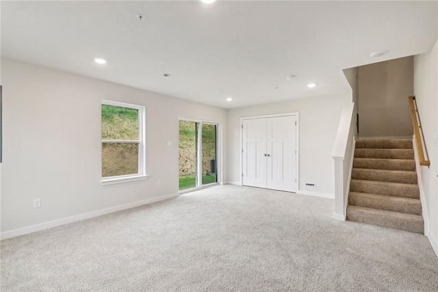 118 River Ridge Drive, Moon/Crescent Twp, PA 15108 - unfurnished living room with carpet floors, recessed lighting, and stairs