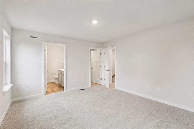 118 River Ridge Drive, Moon/Crescent Twp, PA 15108 - unfurnished bedroom with light carpet, connected bathroom, and recessed lighting