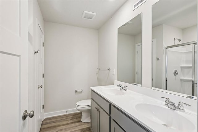 118 River Ridge Drive, Moon/Crescent Twp, PA 15108 - bathroom with wood finished floors, double vanity, and a shower stall