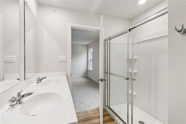 118 River Ridge Drive, Moon/Crescent Twp, PA 15108 - full bathroom with a stall shower, double vanity, and wood finished floors