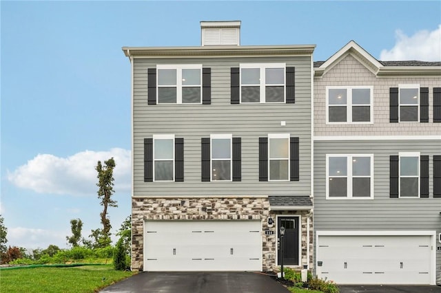 118 River Ridge Drive, Moon/Crescent Twp, PA 15108 - view of front of property featuring a garage, driveway, and stone siding