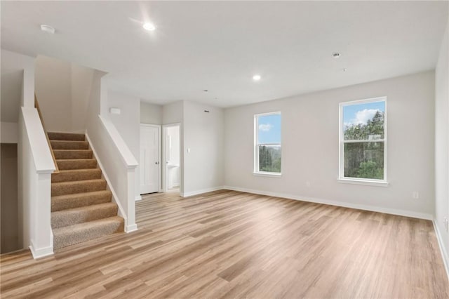 118 River Ridge Drive, Moon/Crescent Twp, PA 15108 - unfurnished living room with light wood-style floors, plenty of natural light, stairway, and recessed lighting