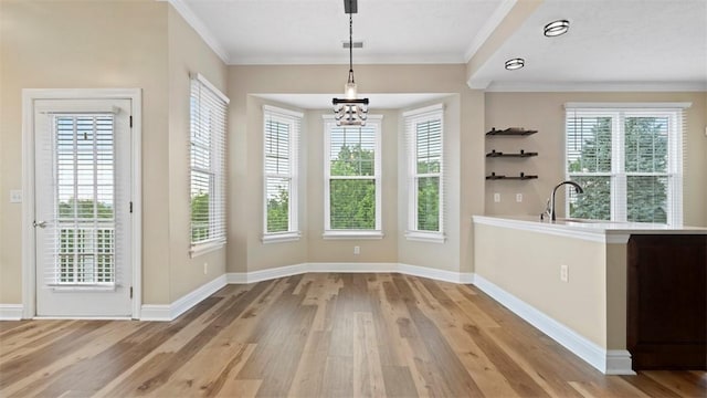 224 Adams Pointe Blvd Unit 1, Adams Twp, PA 16046 - unfurnished dining area featuring wood finished floors, a chandelier, healthy amount of natural light, and crown molding