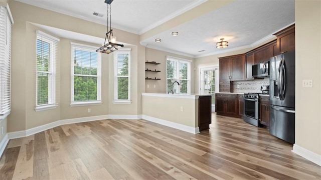 224 Adams Pointe Blvd Unit 1, Adams Twp, PA 16046 - kitchen featuring appliances with stainless steel finishes, crown molding, light wood-type flooring, dark brown cabinets, and light countertops
