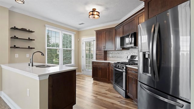 224 Adams Pointe Blvd Unit 1, Adams Twp, PA 16046 - kitchen featuring appliances with stainless steel finishes, ornamental molding, open shelves, light wood finished floors, and light countertops