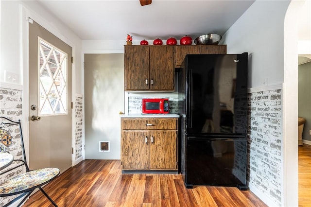 1029 3rd St, Baden, PA 15005 - kitchen with freestanding refrigerator, wood finished floors, and light countertops