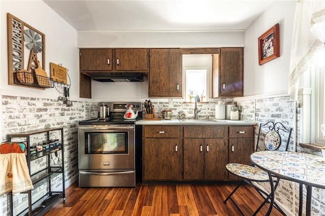 1029 3rd St, Baden, PA 15005 - kitchen featuring electric range, under cabinet range hood, light countertops, dark wood-style flooring, and dark brown cabinetry