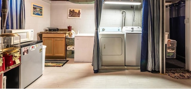 1029 3rd St, Baden, PA 15005 - washroom with washer and clothes dryer and concrete block wall