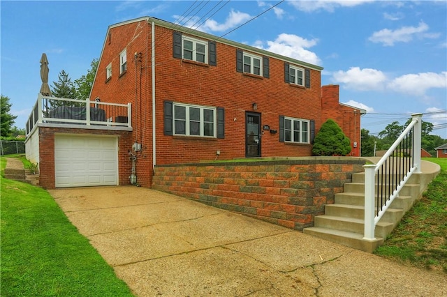 1445 Raven Dr, Pittsburgh, PA 15243 - view of front facade featuring brick siding, driveway, and a balcony