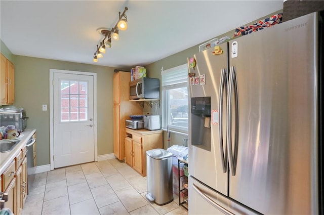 1445 Raven Dr, Pittsburgh, PA 15243 - kitchen featuring appliances with stainless steel finishes, light countertops, and track lighting