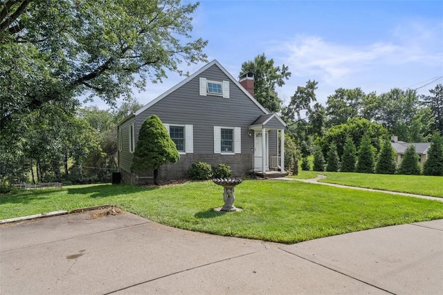 2324 Mcaleer Rd, Franklin Park, PA 15143 - view of front of house with a front lawn, a chimney, and brick siding