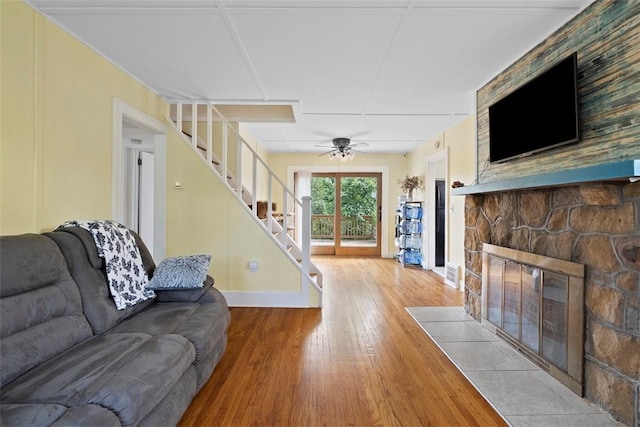 2324 Mcaleer Rd, Franklin Park, PA 15143 - living area with a stone fireplace, stairs, hardwood / wood-style floors, and a ceiling fan