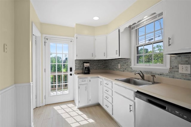 2324 Mcaleer Rd, Franklin Park, PA 15143 - kitchen with dishwasher, light countertops, white cabinets, decorative backsplash, and wainscoting