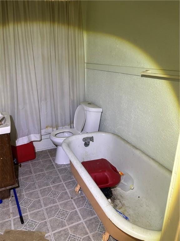 15 E Gaskill Ave, Jeannette, PA 15644 - full bathroom featuring a freestanding bath, tile patterned flooring, and vanity