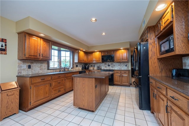 803 Birch Field Ct, Marshall, PA 15090 - kitchen with black appliances, brown cabinetry, a center island, backsplash, and recessed lighting