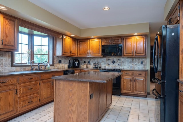 803 Birch Field Ct, Marshall, PA 15090 - kitchen with black appliances, light tile patterned floors, brown cabinets, a kitchen island, and decorative backsplash