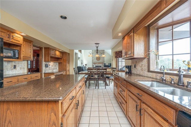 803 Birch Field Ct, Marshall, PA 15090 - kitchen featuring brown cabinetry, black appliances, light tile patterned floors, backsplash, and recessed lighting