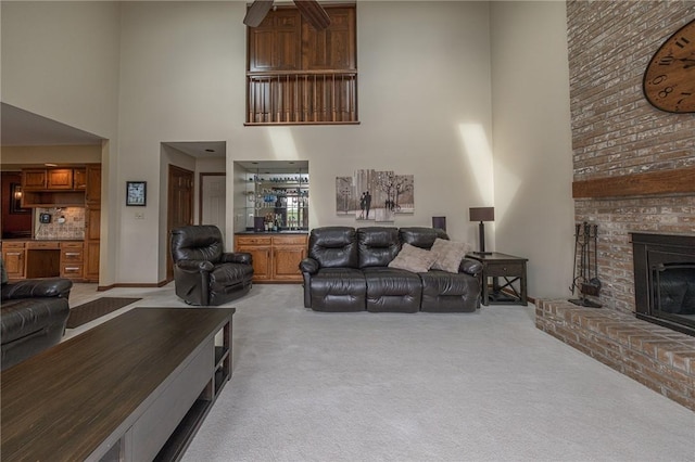 803 Birch Field Ct, Marshall, PA 15090 - living area with a towering ceiling, light colored carpet, a fireplace, and a ceiling fan