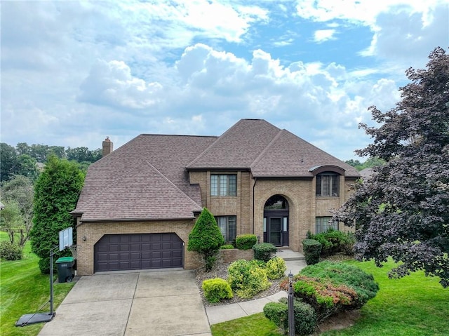 803 Birch Field Ct, Marshall, PA 15090 - french country inspired facade featuring a front lawn, a garage, roof with shingles, concrete driveway, and brick siding