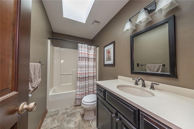 803 Birch Field Ct, Marshall, PA 15090 - bathroom with vanity, stone finish floors, shower / bath combination with curtain, and a skylight